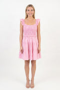 Front fit of the Completely In Tune pink crochet dress in Small, showing its square neck and tiered skirt.