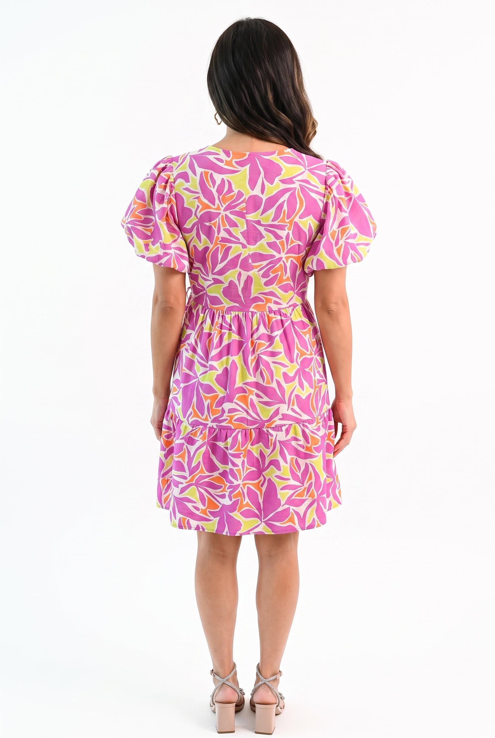 Back fit of the Somewhere Sunny floral dress showing its closed bodice and gathered skirt tier.