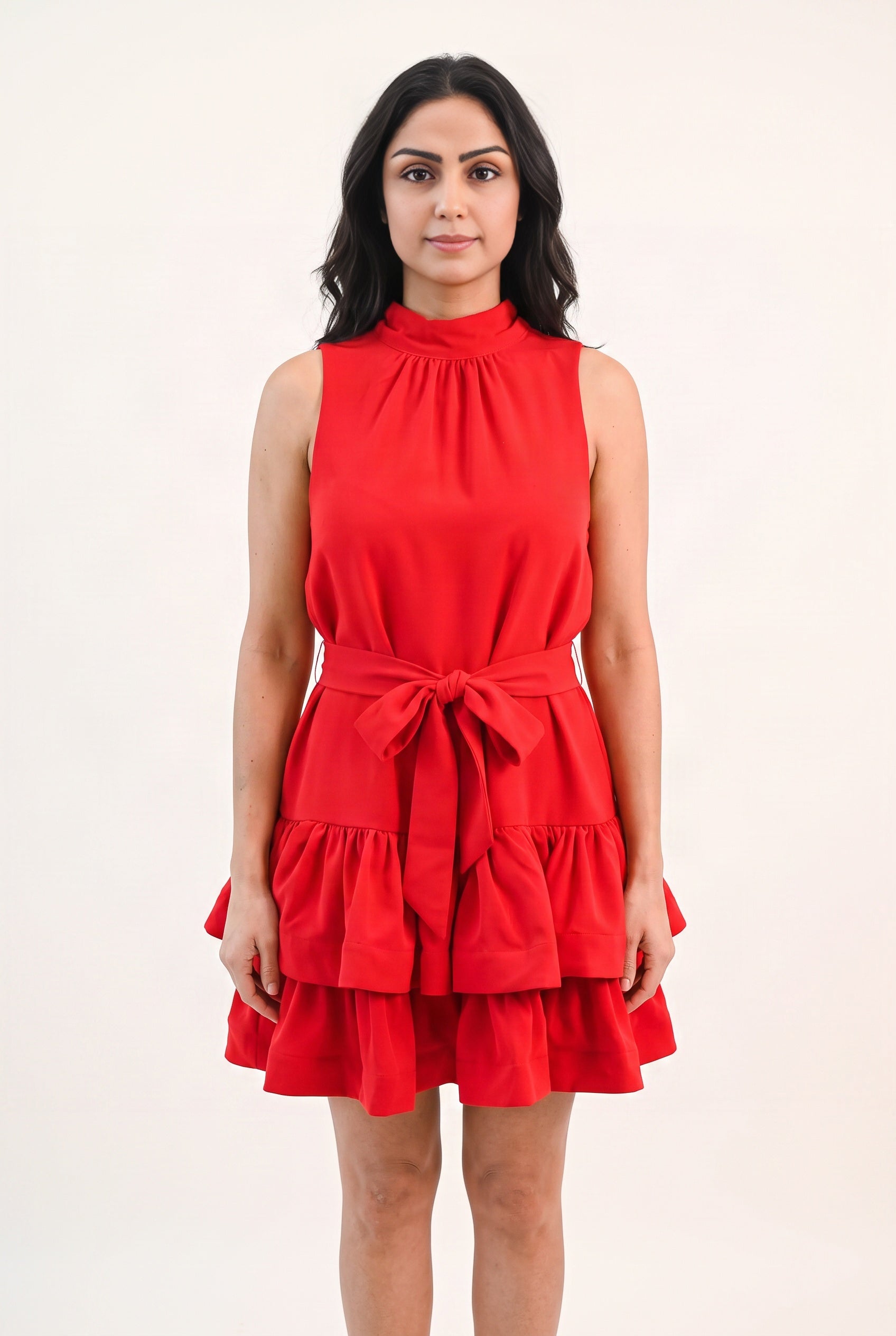 Front fit of the red ruffle tiered mini dress in size Small on Shweta.