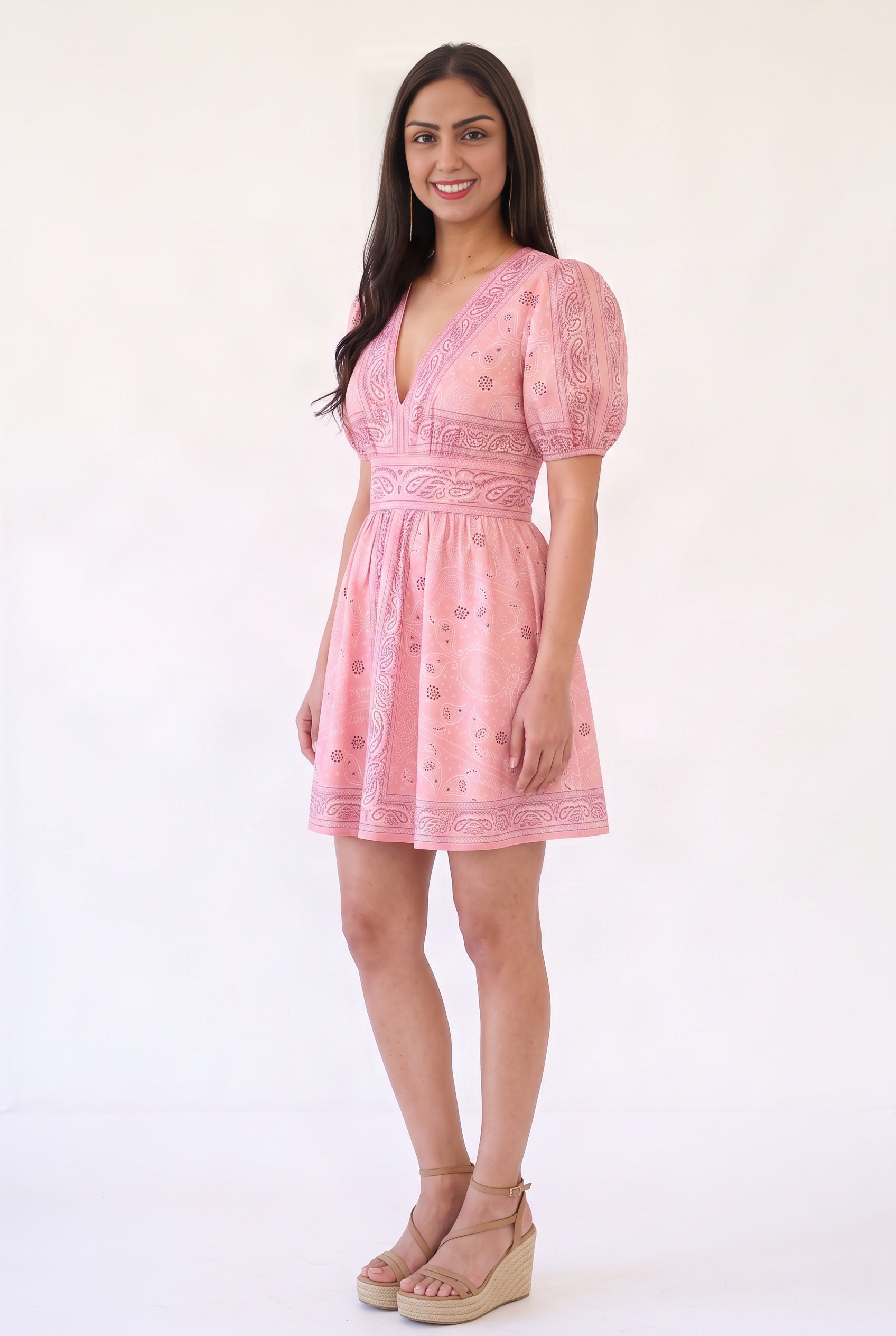 Angled side fit of the pink Forget Me Not Paisley Dress showing sleeve volume, waist placement and skirt flare.