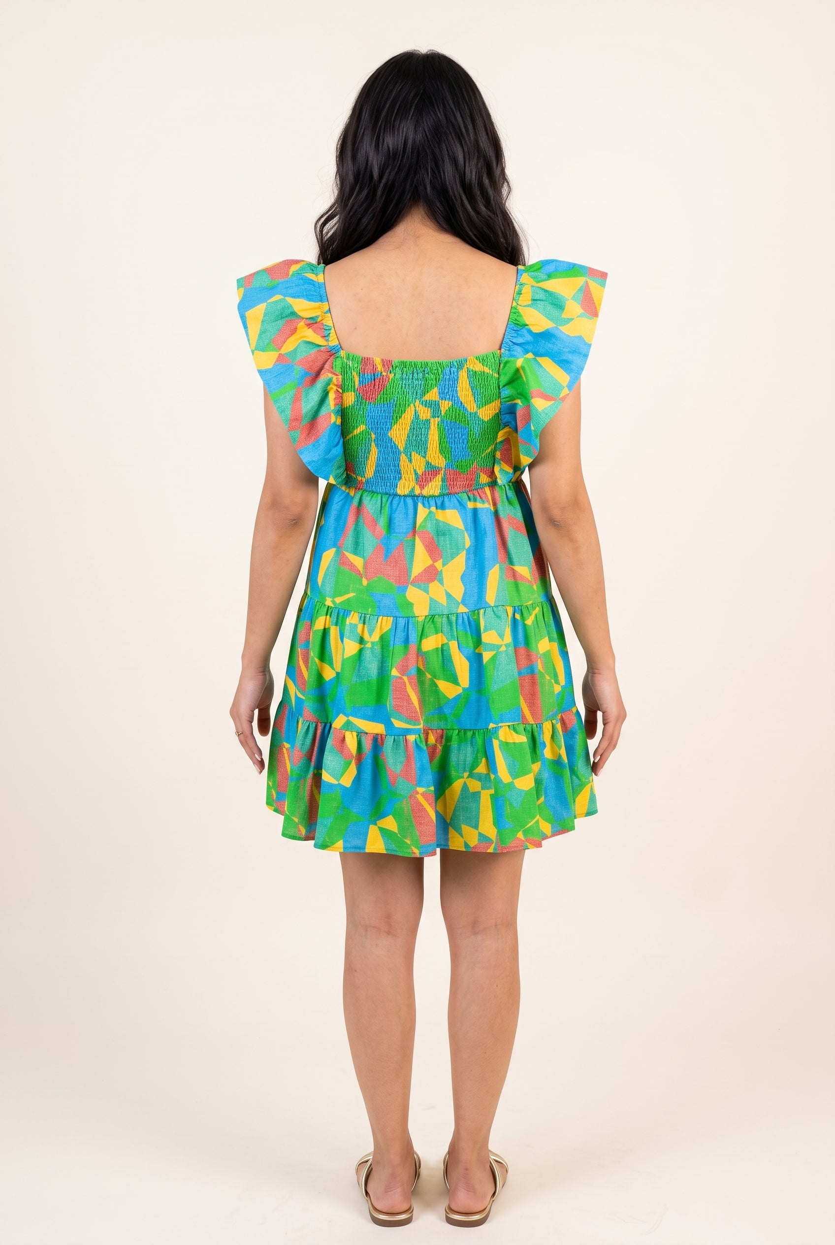 Back fit of the flutter sleeve mini dress showing the square back and smocked bodice.