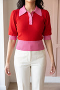 Front fit of the red and pink collared sweater in Small with the full waistband visible.