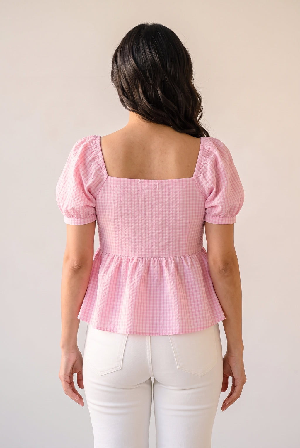 Back fit of the Blushing For You pink gingham top in Small, showing its neckline, shaping and peplum.