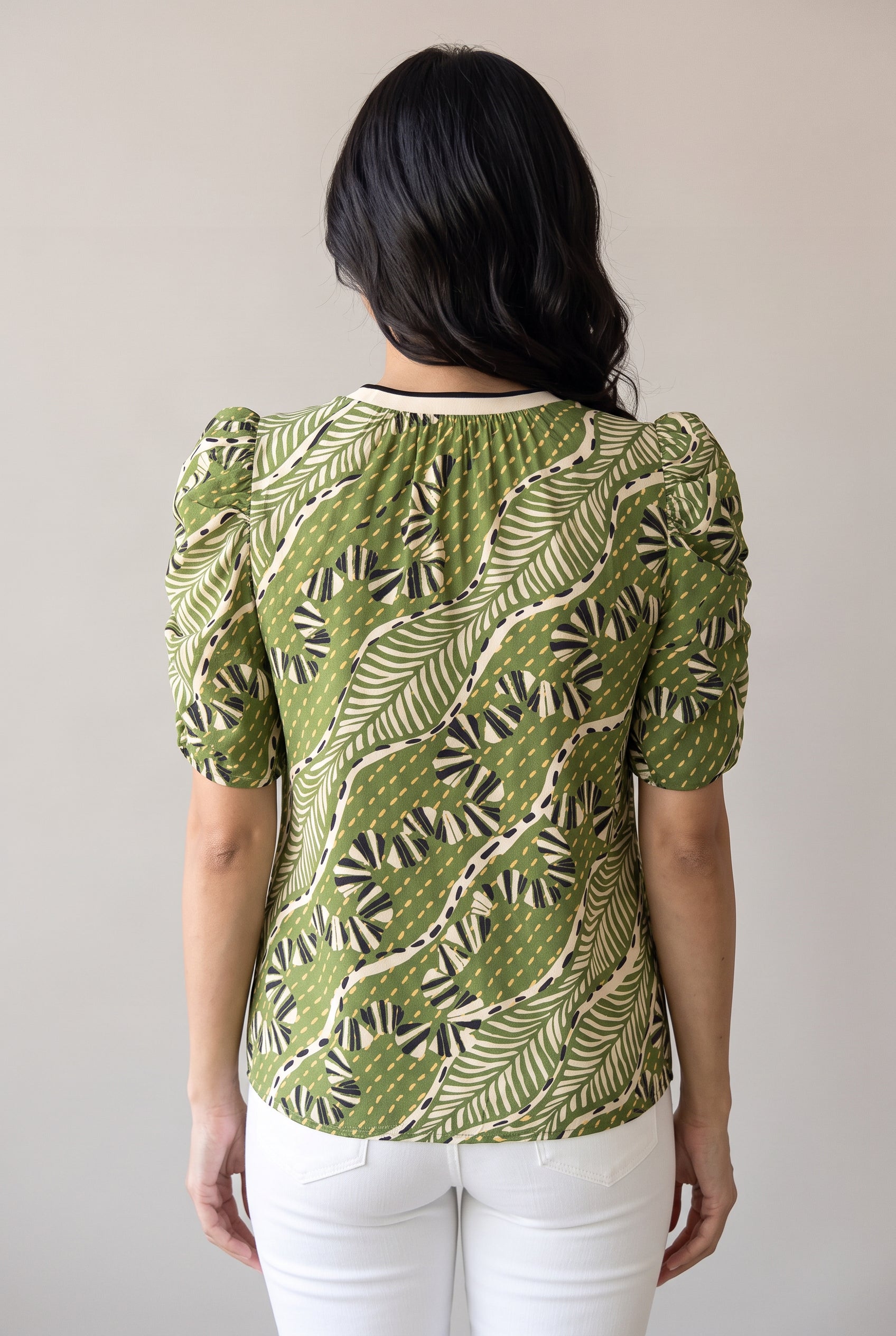 Back fit of the Young Wild and Free Puff Sleeve Top in Small showing its clean back and curved hem.