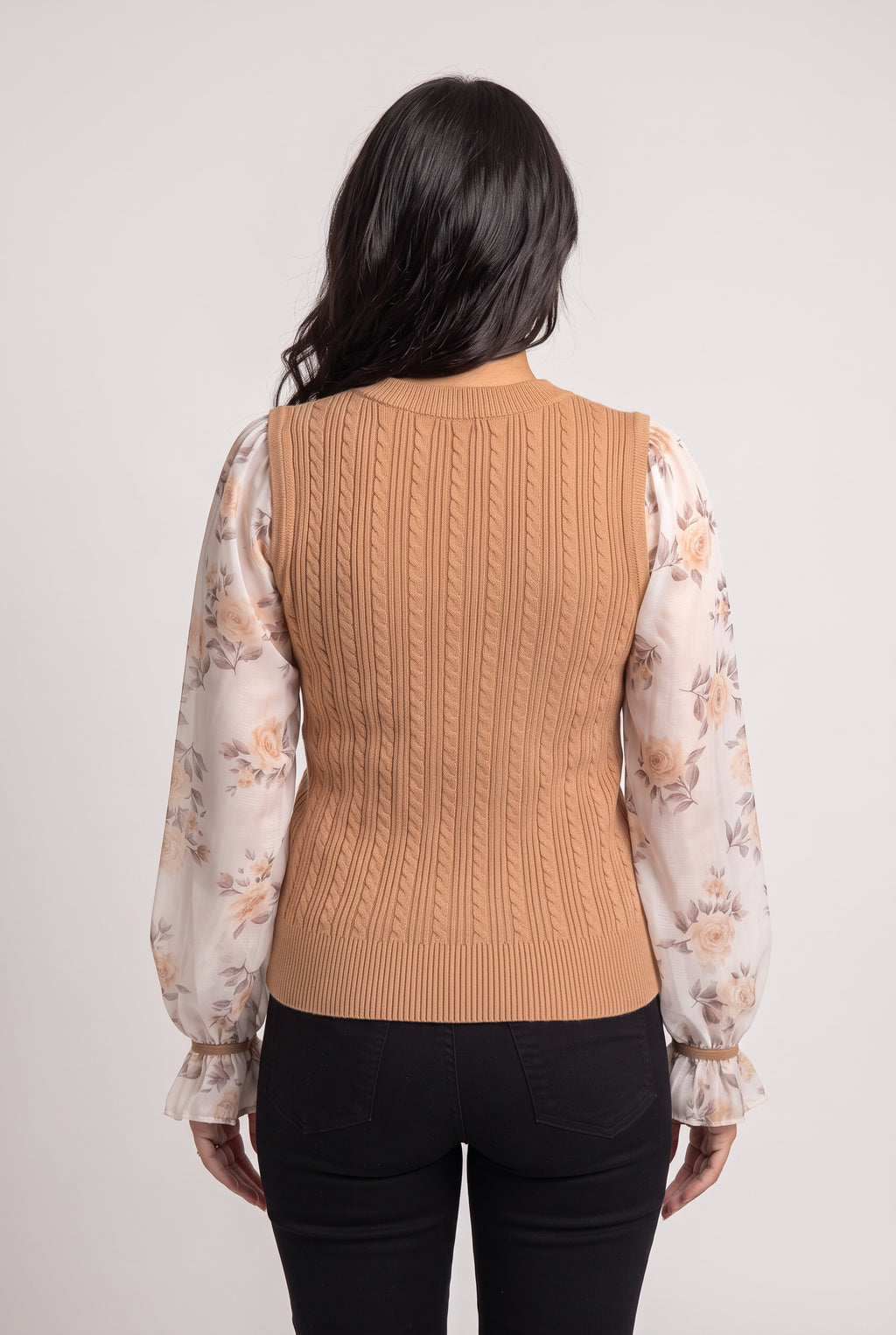 Back fit of the Wanna Be With You Knit Sweater Top showing continuous cables and the untucked hem.