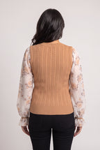 Back fit of the Wanna Be With You Knit Sweater Top showing continuous cables and the untucked hem.