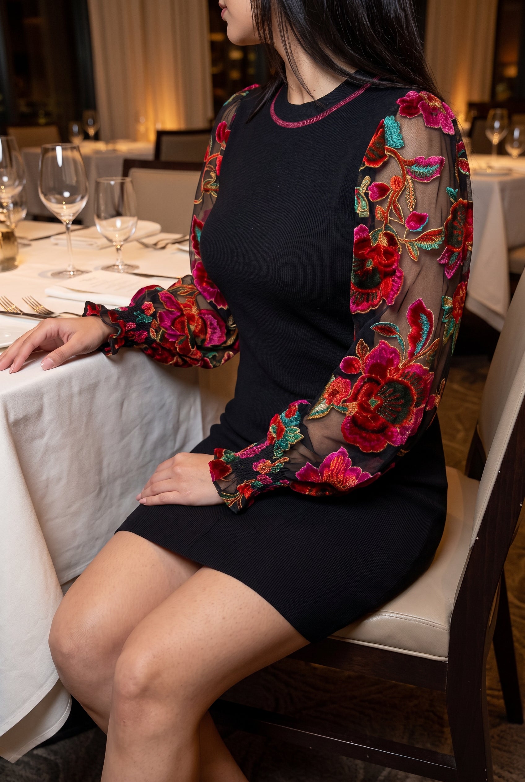 You're My Favorite Sweater Dress worn seated at dinner, showing hem coverage and statement sleeves.
