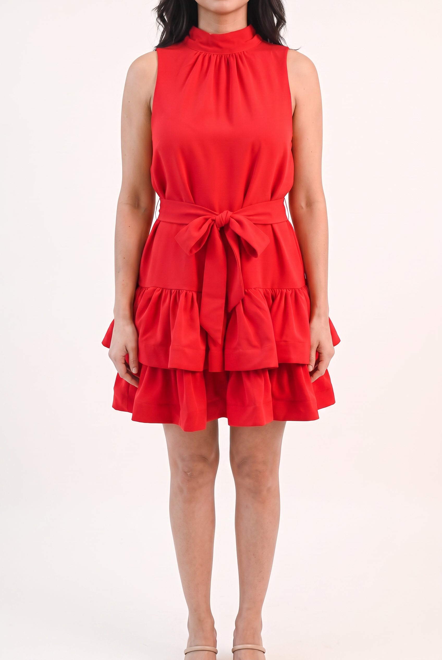 Front fit of the red ruffle tiered mini dress in size Small on Shweta.