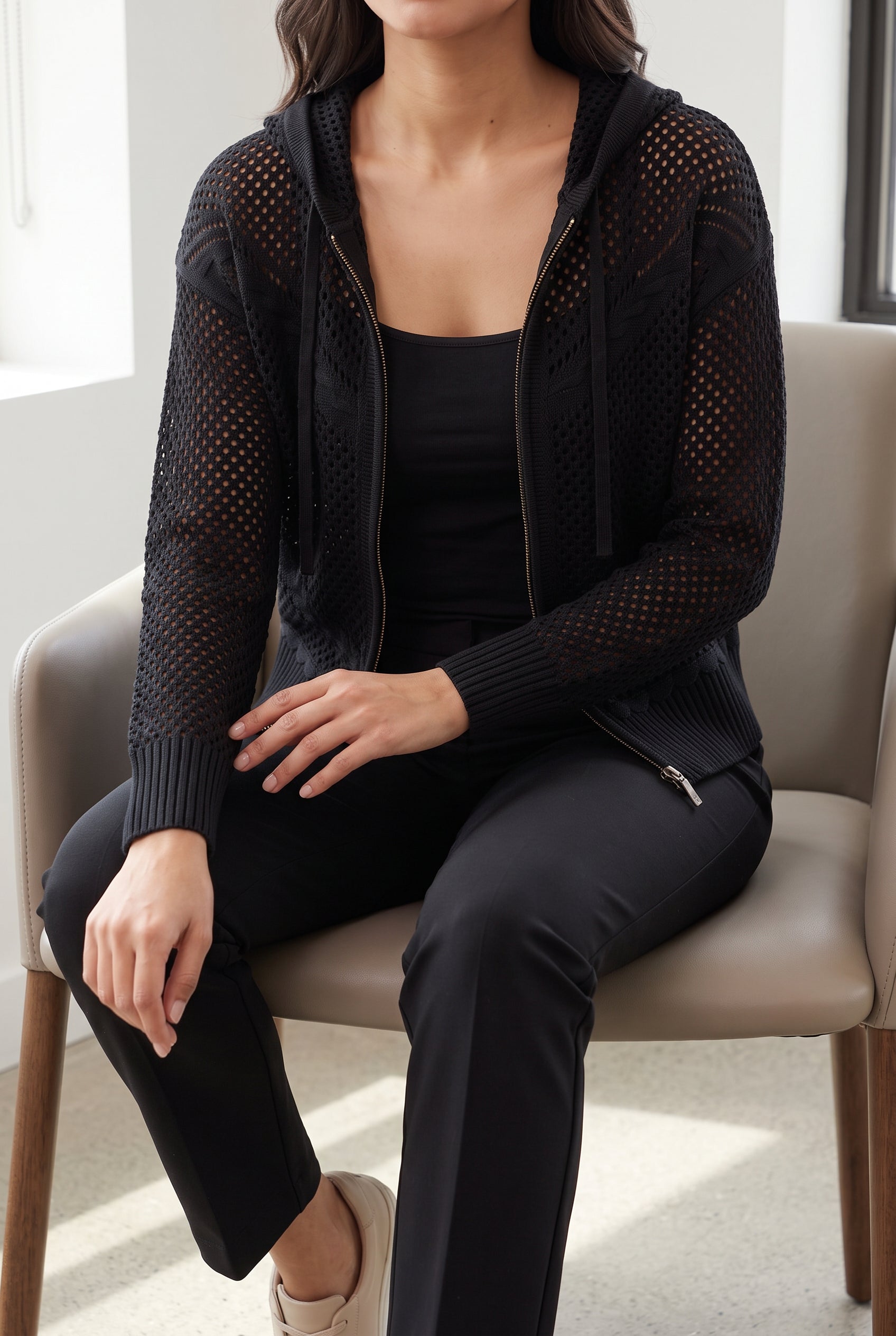 Got My Reasons Crochet Zip Hoodie in Small worn seated, showing sleeve and hem mobility.