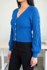 Tell Me About It Sweater Top in side profile showing the fitted body, balloon sleeve and untucked hem.