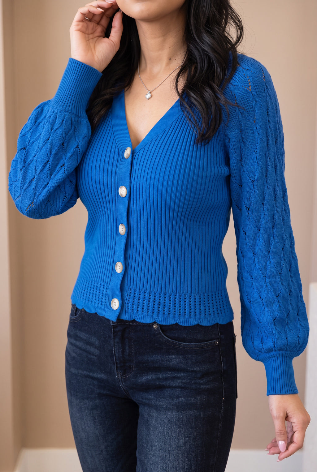 Tell Me About It Sweater Top during an arm lift, showing sleeve fall and movement at the waist.