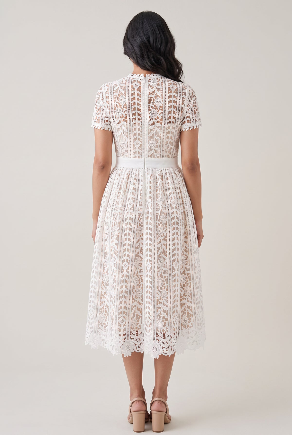 Back view of Sunset Stroll white lace midi dress in Small showing the center zipper and scalloped hem.