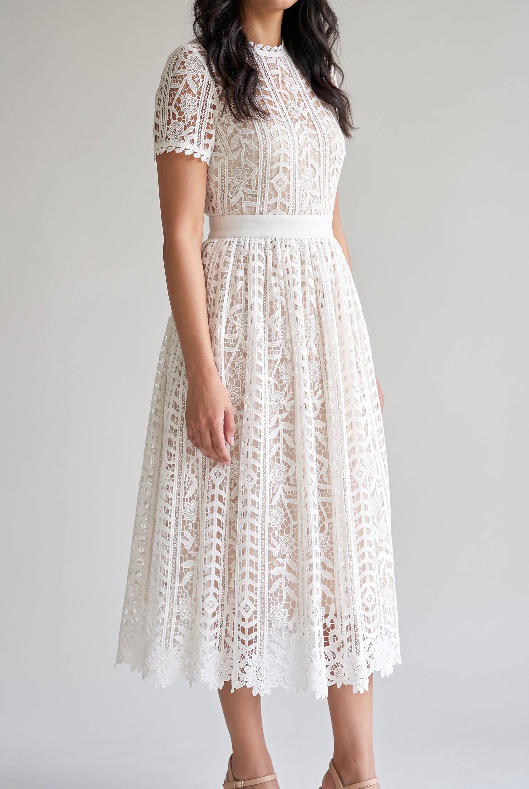 Angled side fit of Sunset Stroll white lace midi dress in Small showing waist and structured skirt volume.