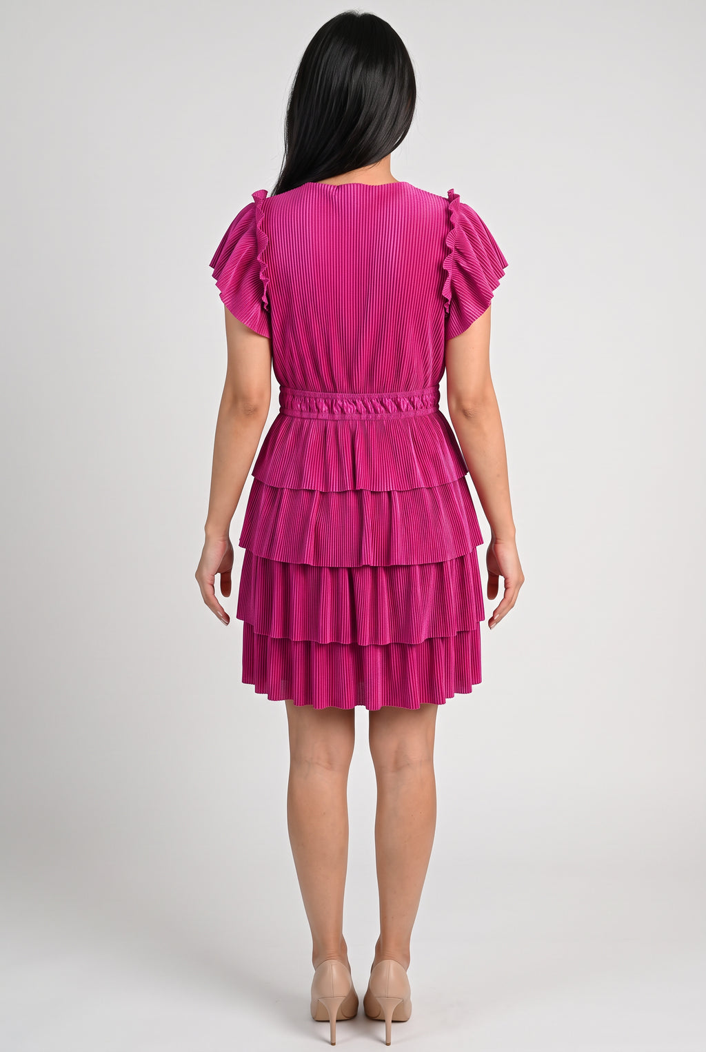 Back fit of the Small Magenta tiered dress showing the high neckline, elastic waist and continuous flounces.
