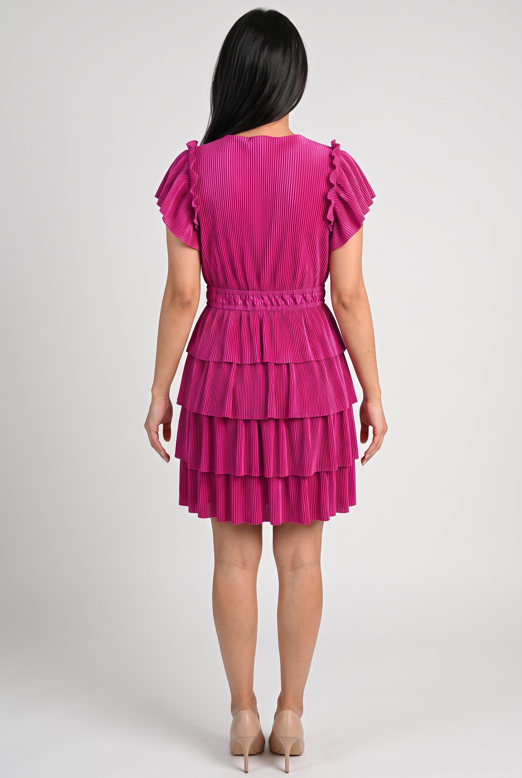 Back fit of the Small Magenta tiered dress showing the high neckline, elastic waist and continuous flounces.