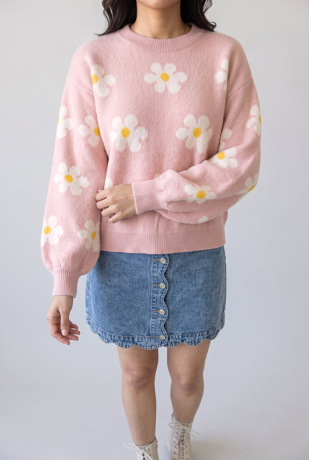 Let's Just Stay Floral Sweater in gentle arm movement, showing the volume and gather of its balloon sleeve.