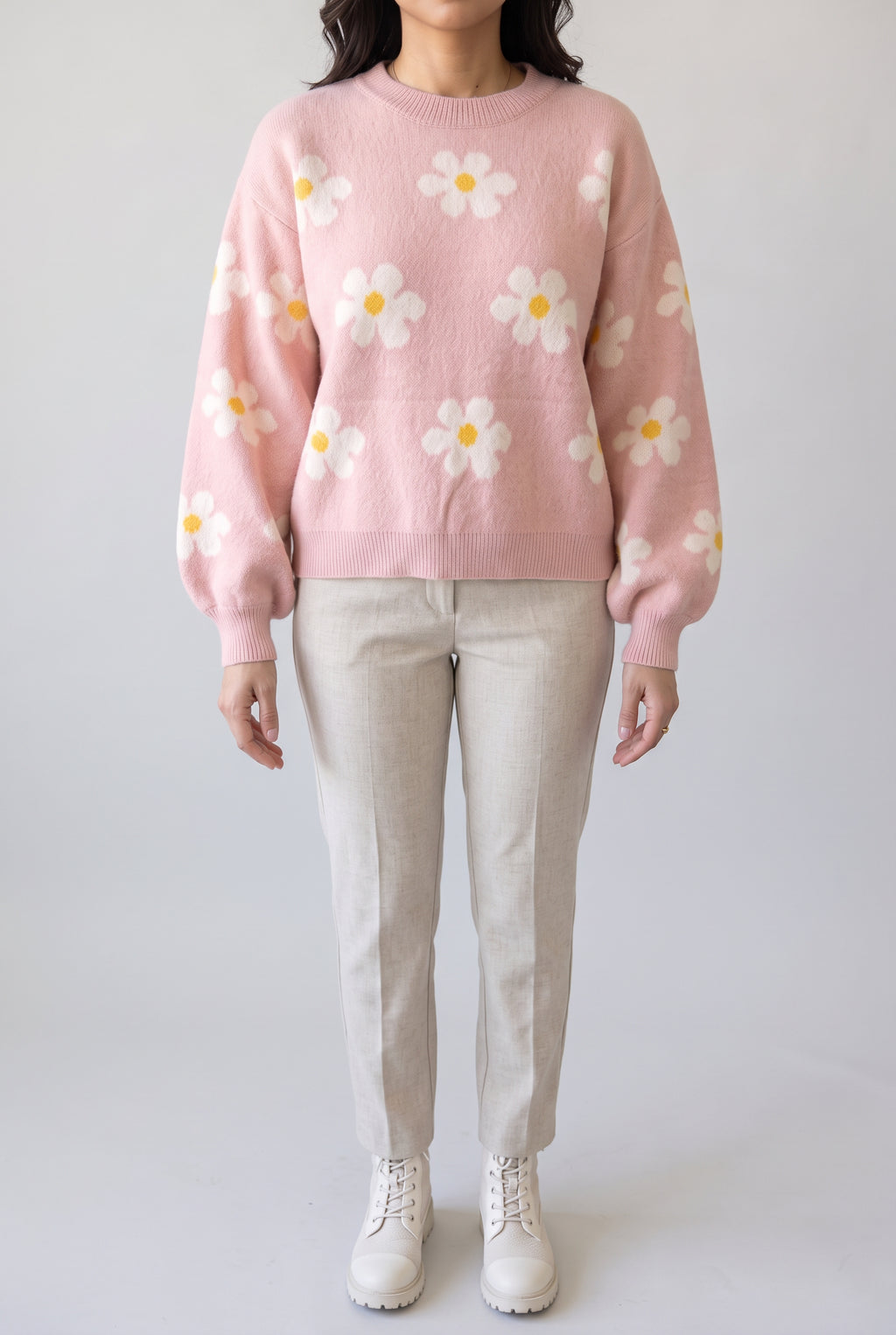 Let's Just Stay Floral Sweater styled with oatmeal trousers, showing its relaxed shape and balloon sleeves.