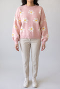 Let's Just Stay Floral Sweater styled with oatmeal trousers, showing its relaxed shape and balloon sleeves.