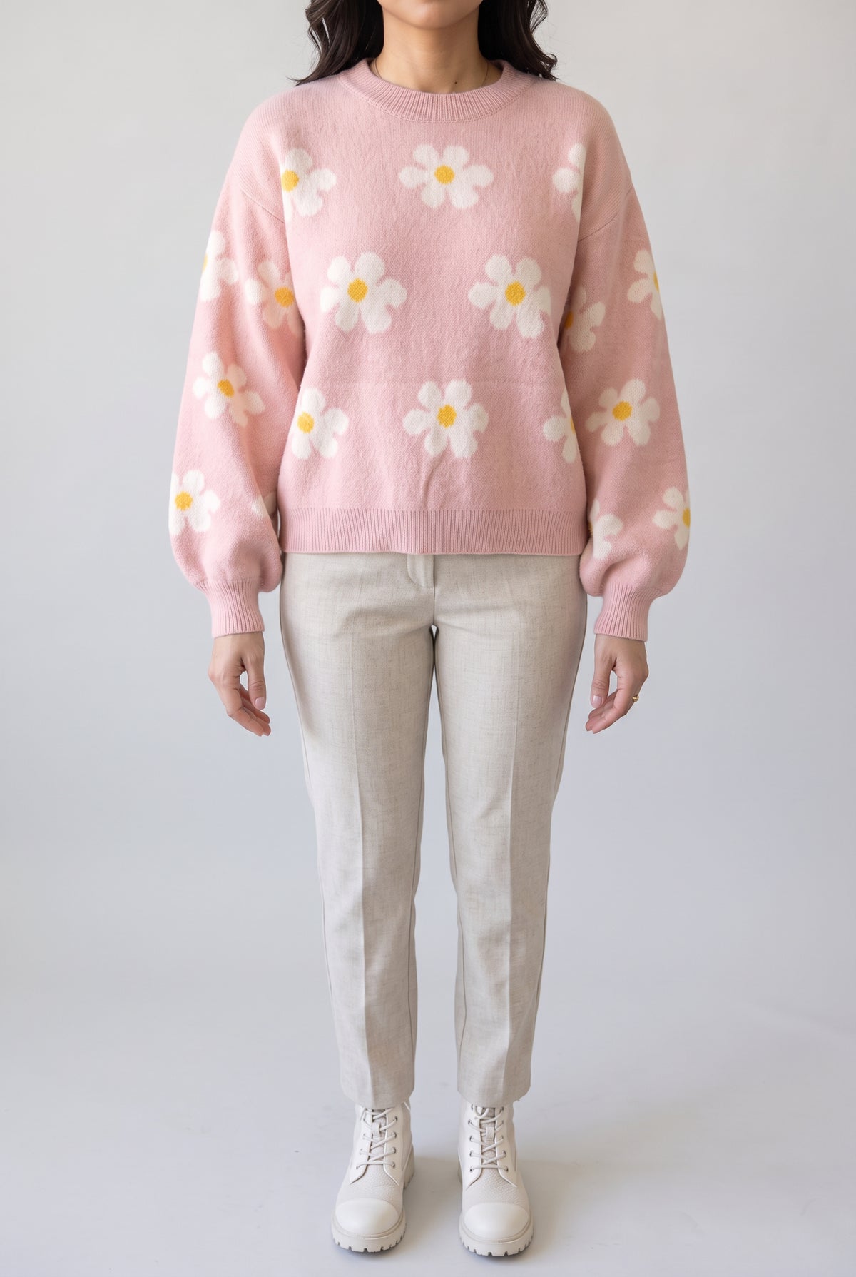 Let's Just Stay Floral Sweater styled with oatmeal trousers, showing its relaxed shape and balloon sleeves.