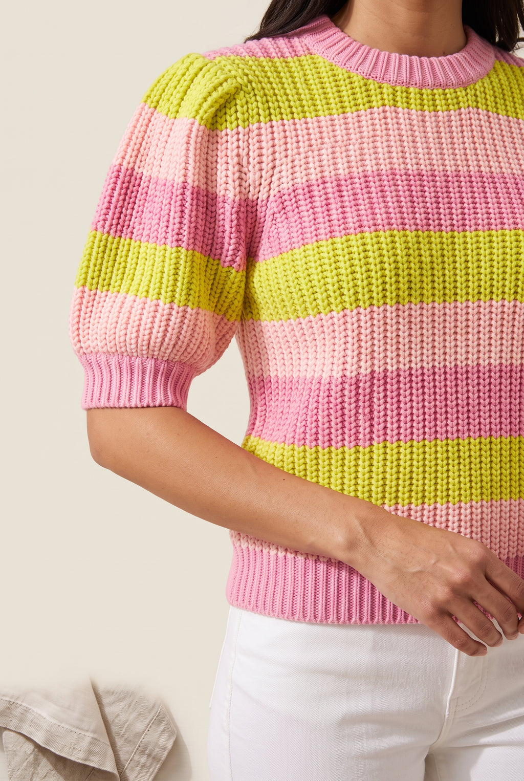 Close detail of the striped sweater’s chunky knit, shoulder tucks, crew neck and ribbed cuff.