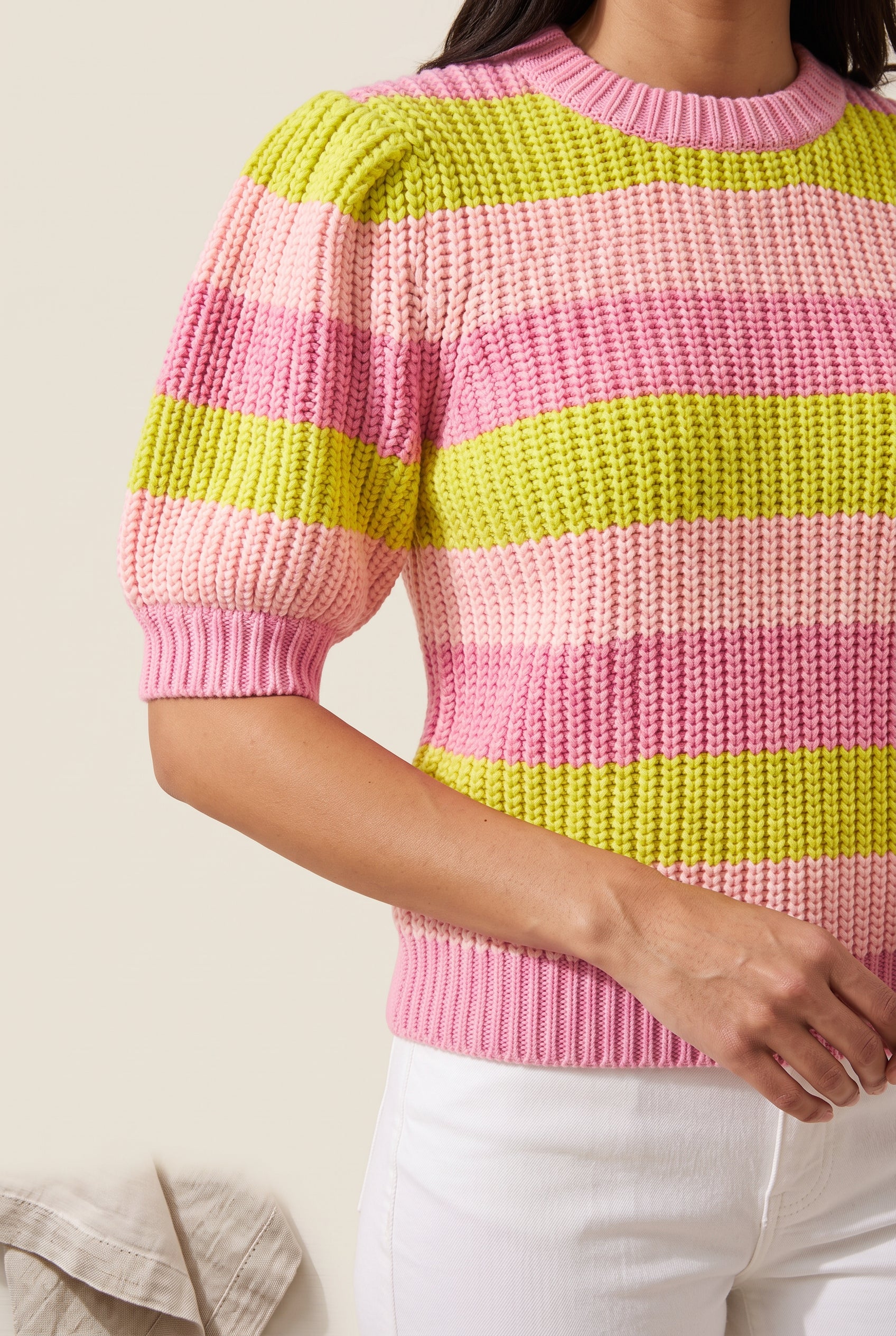 Close detail of the striped sweater’s chunky knit, shoulder tucks, crew neck and ribbed cuff.