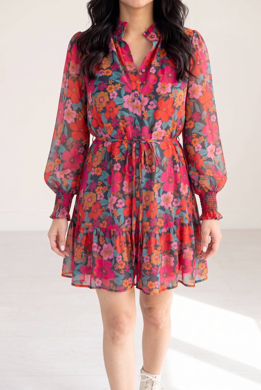 Only If You Knew Floral Dress in Small worn in bright daylight, showing its floral color and lined mini skirt.