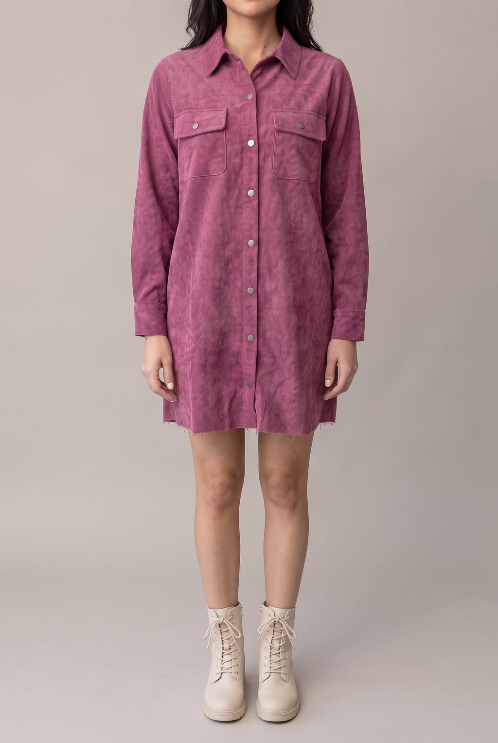 Front view of the Small mauve corduroy shirt dress showing its relaxed mini fit and metal snap placket.