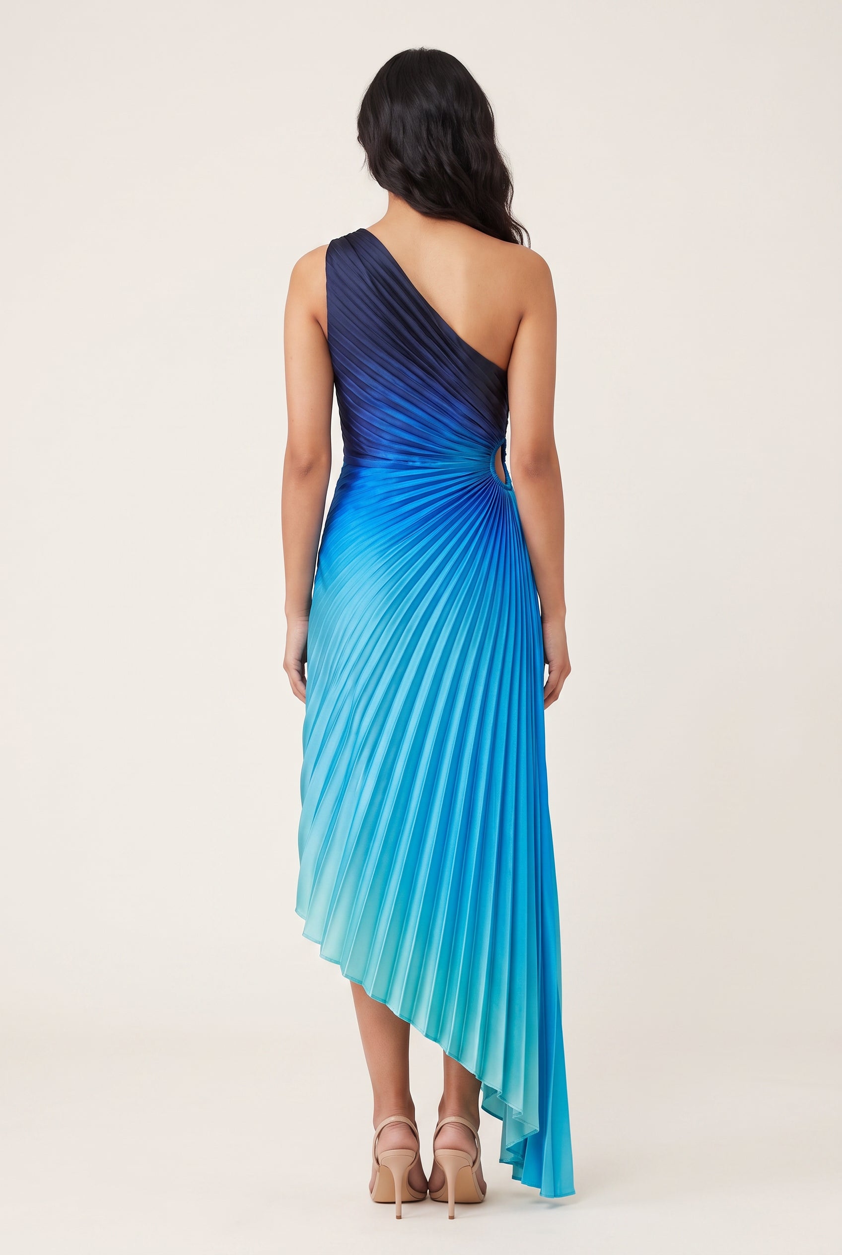 Straight back view of the blue ombre pleated maxi dress showing the open back and rear hem.