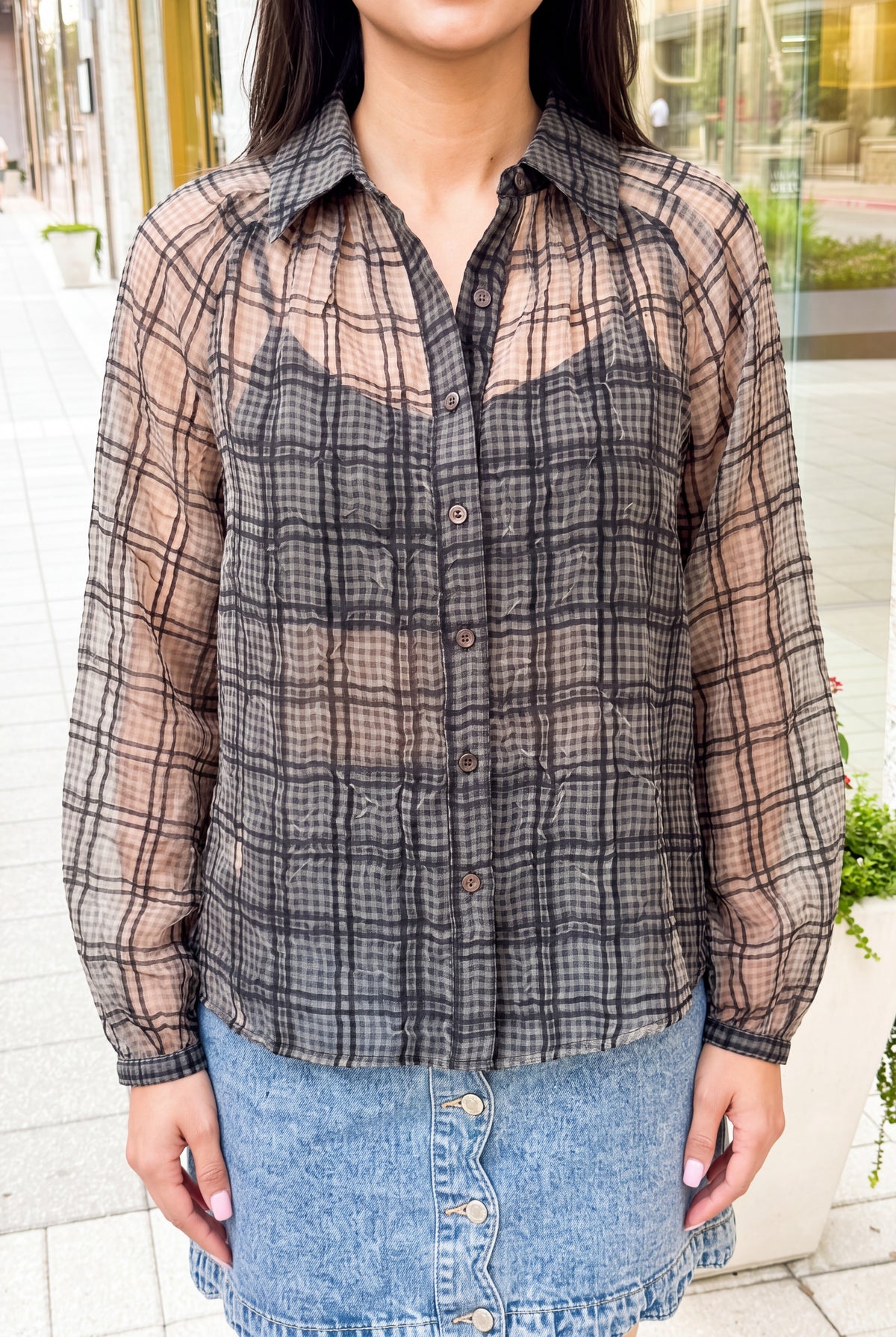 Sheer plaid, crinkled texture, dark buttons and gathered cuff of the Just Looking blouse.
