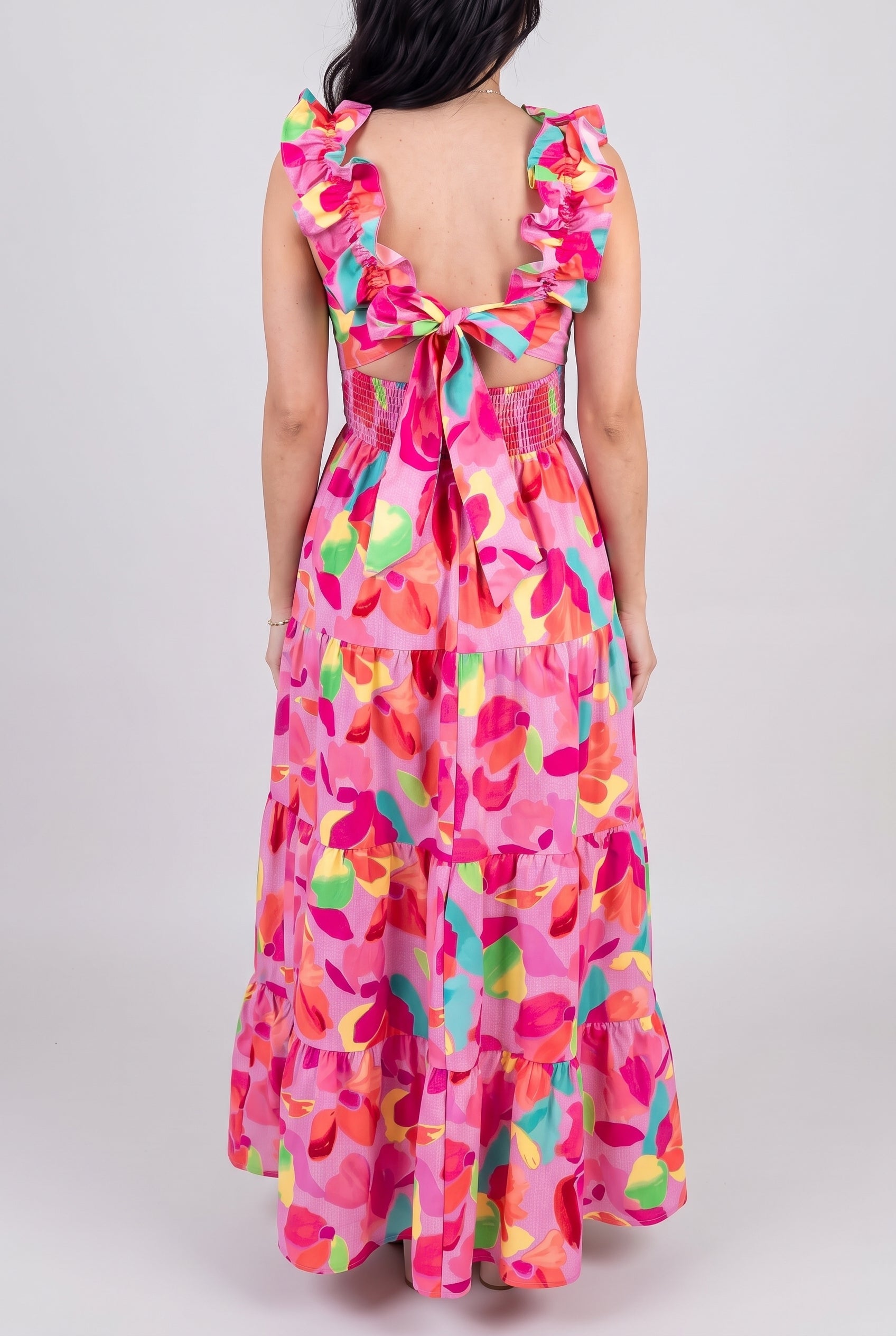Front view of Blooming Affair floral maxi dress showing its fitted bodice and tiered full-length skirt.