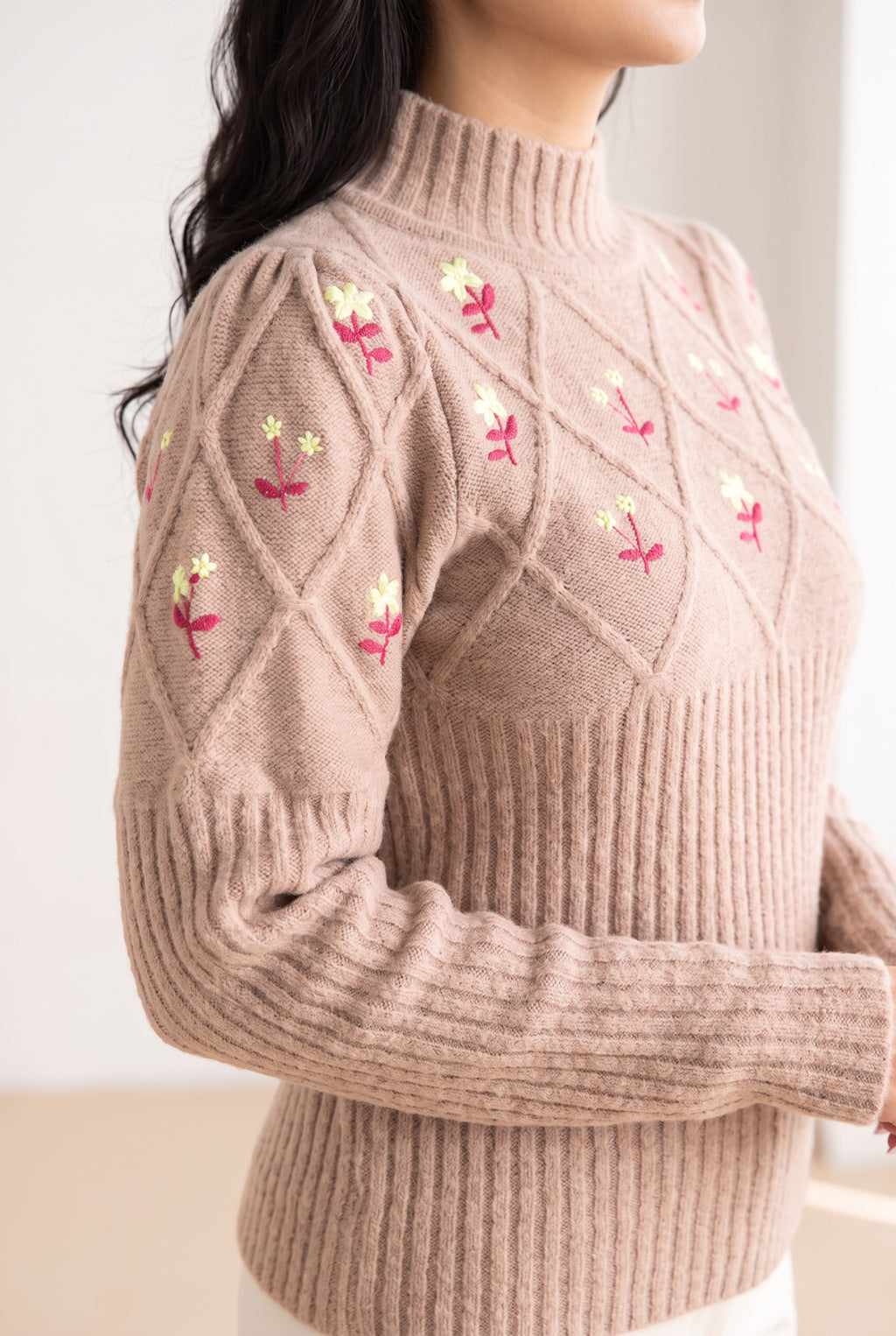 Happy Times Floral Sweater sleeve showing its gathered shoulder, textured upper arm, and ribbed forearm.