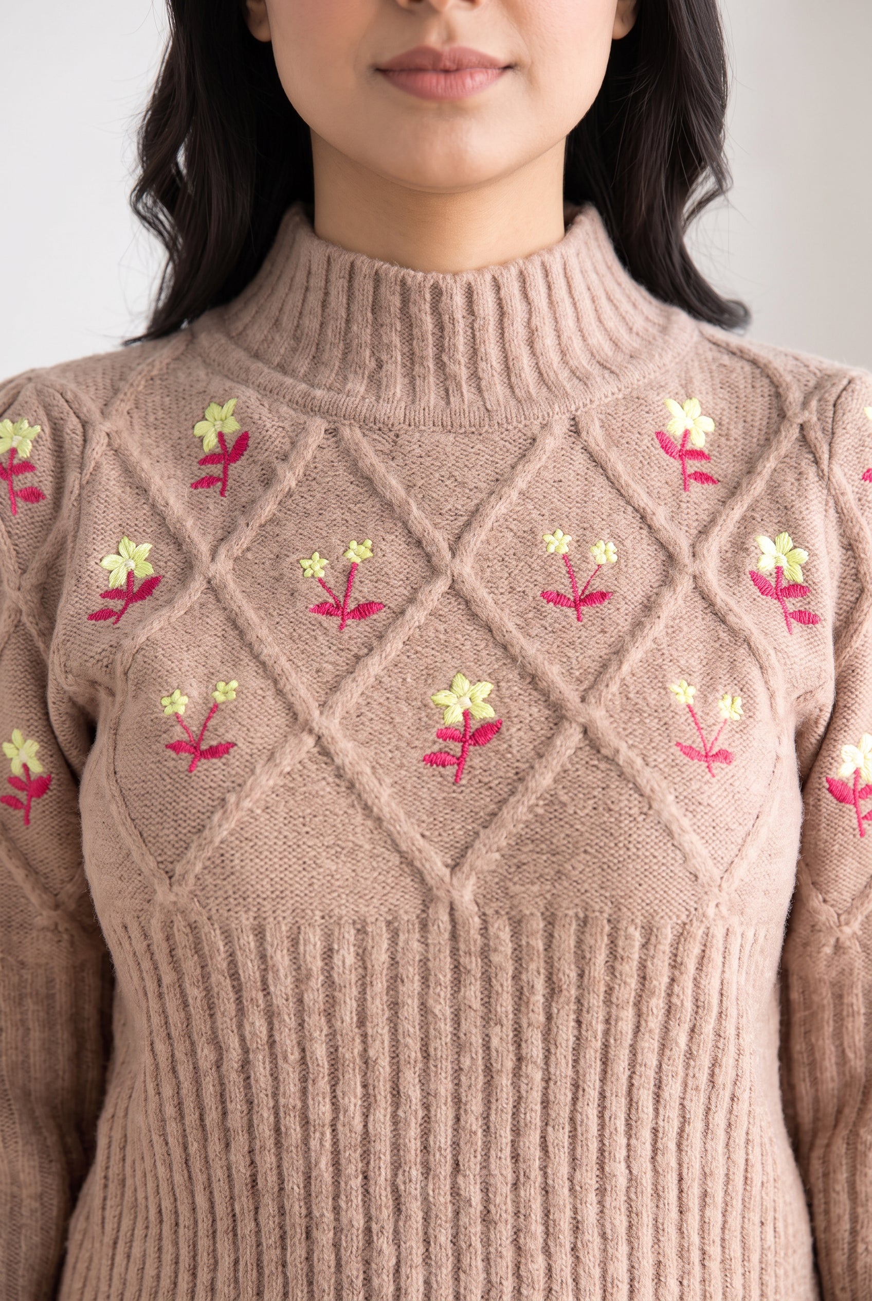 Close view of the Happy Times Floral Sweater showing the ribbed mock neck and yoke join.