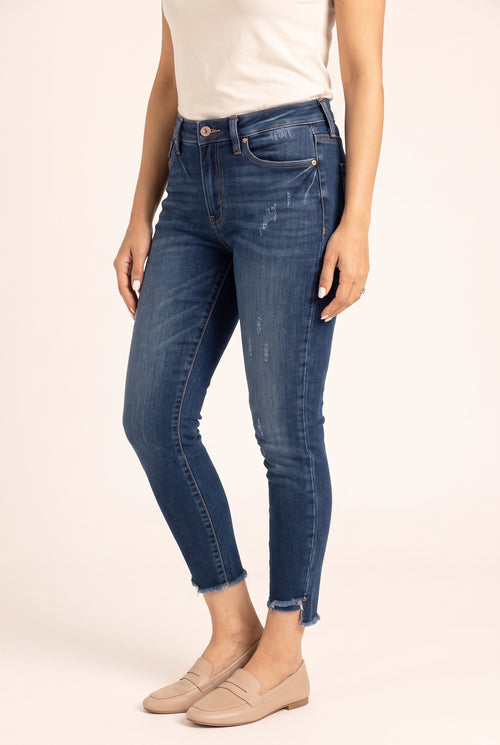 Angled side view of Beautiful Day Mid Rise Ankle Jeans showing the close leg fit and ankle crop.