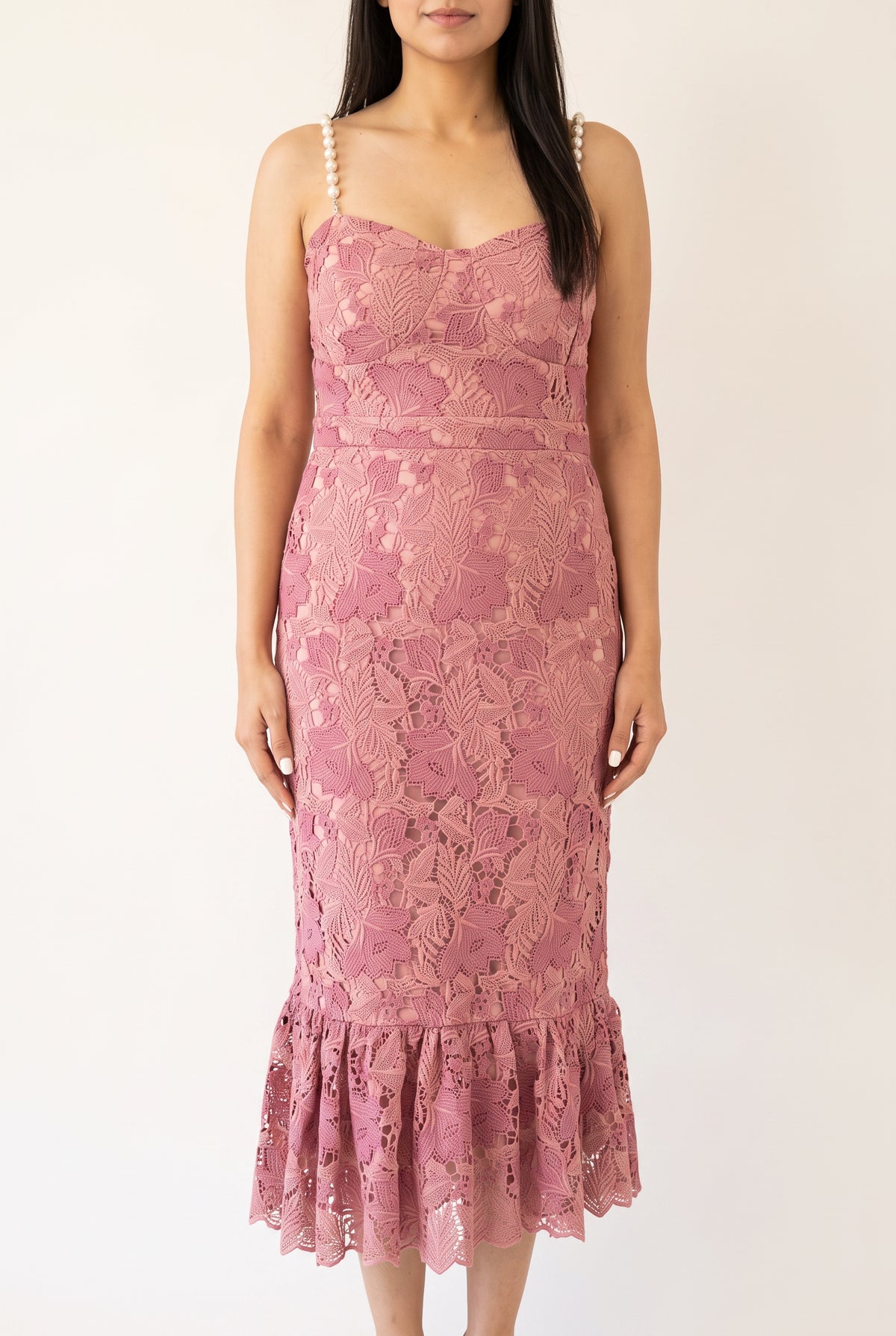 Front view of the pink pearl-trim mermaid midi dress showing its lined lace body and flounced hem.