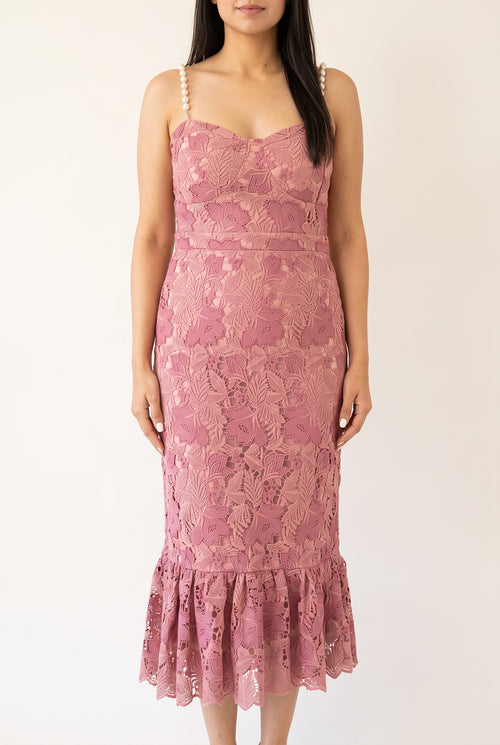 Front view of the pink pearl-trim mermaid midi dress showing its lined lace body and flounced hem.
