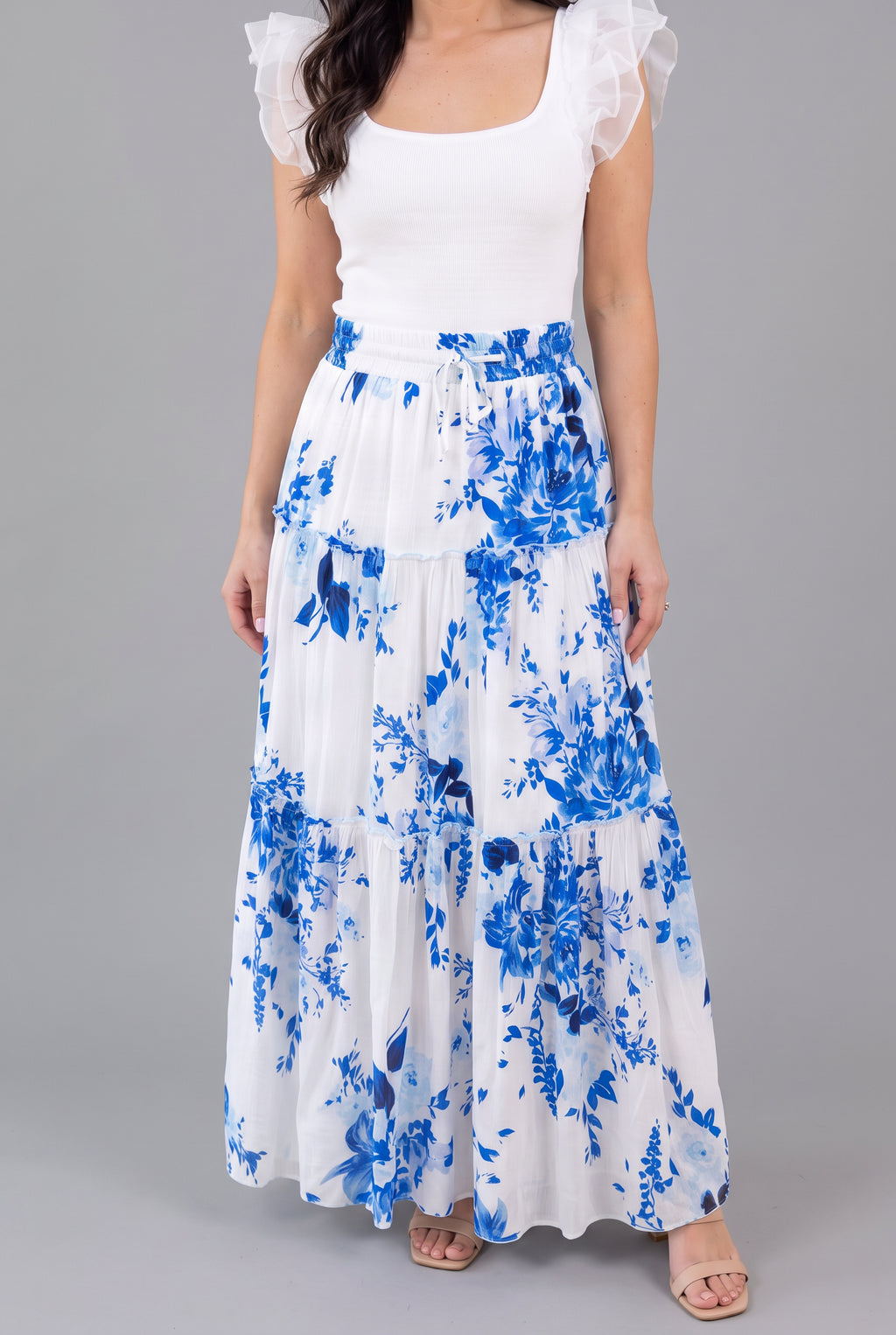 Front fit of the blue floral tiered maxi skirt in Small on Shweta.