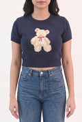 Front fit of the navy teddy bear sweater top in Small with its cropped ribbed hem.