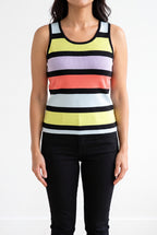 Calm Down Striped Tank Top styled untucked with tailored black trousers in a bright studio.