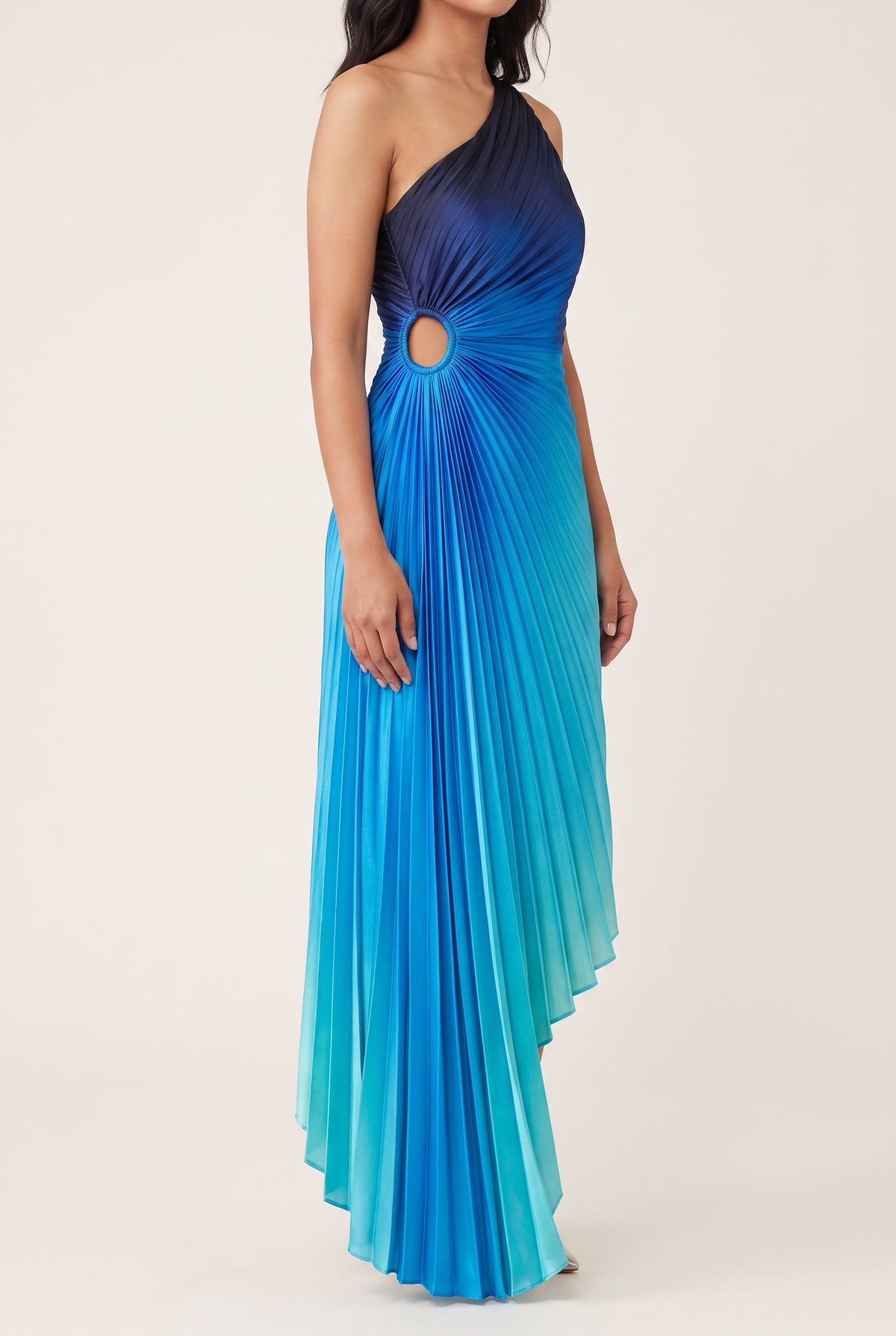 Angled side view of the blue ombre maxi dress showing the waist cutout and sweeping hem.