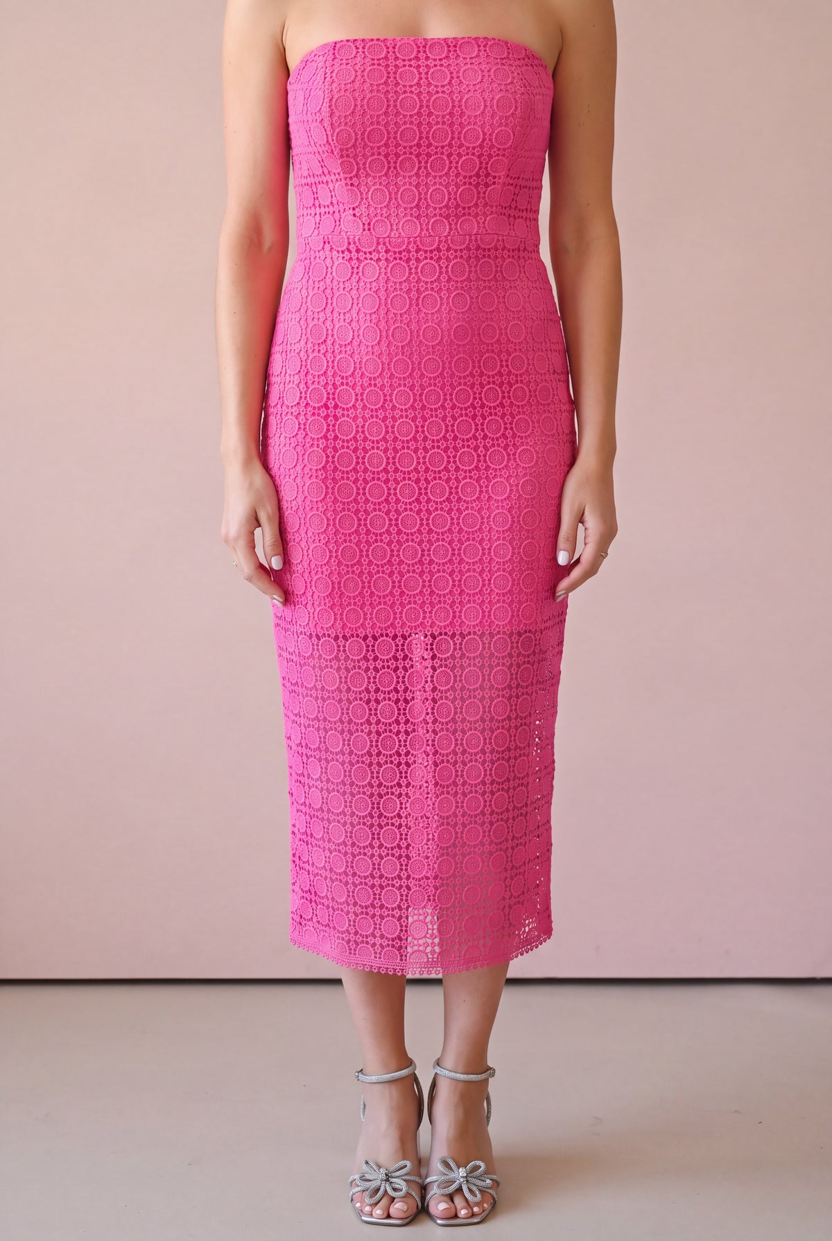 Close detail of the Kiss Me More dress showing raised pink lace over its tonal lining.