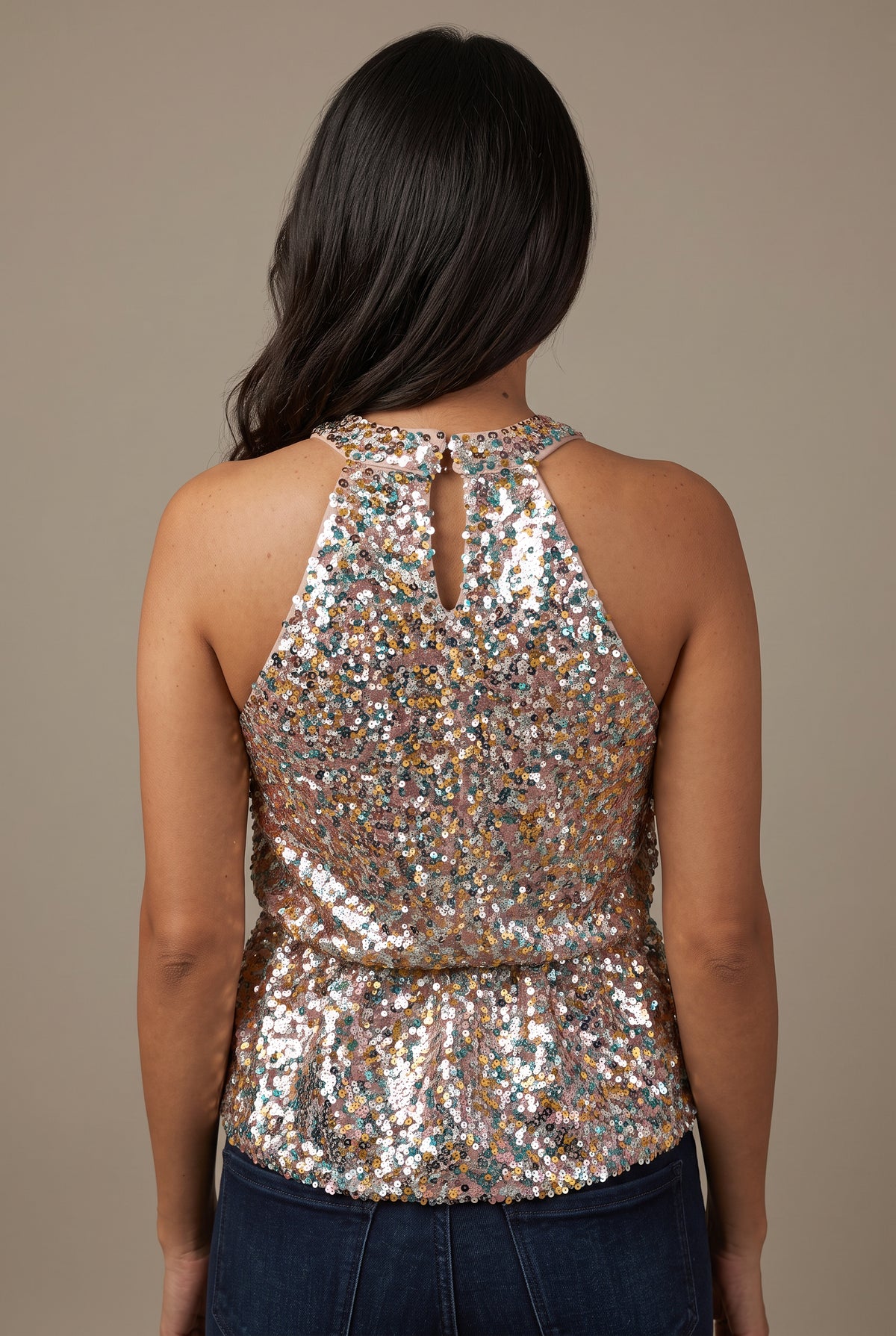 Back of the Last Night Sequin Halter Top showing its keyhole, waist seam and flared hem.