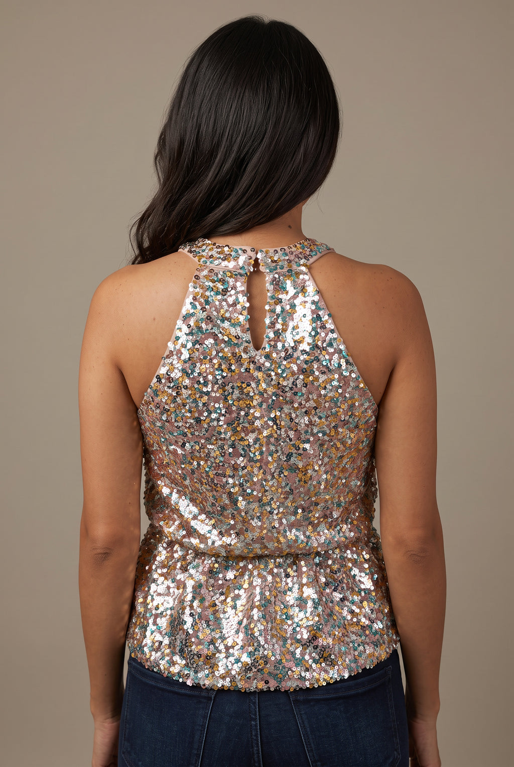 Back of the Last Night Sequin Halter Top showing its keyhole, waist seam and flared hem.