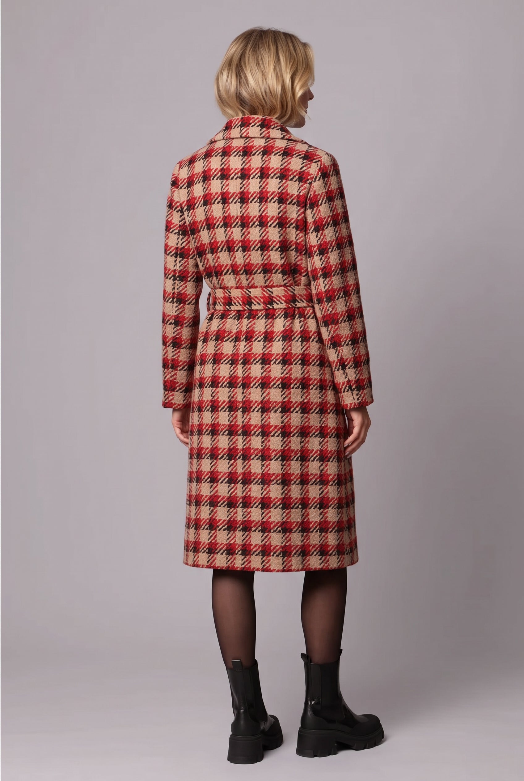 Rear three-quarter view of the plaid belted coat in Small, showing its back silhouette and belt placement.
