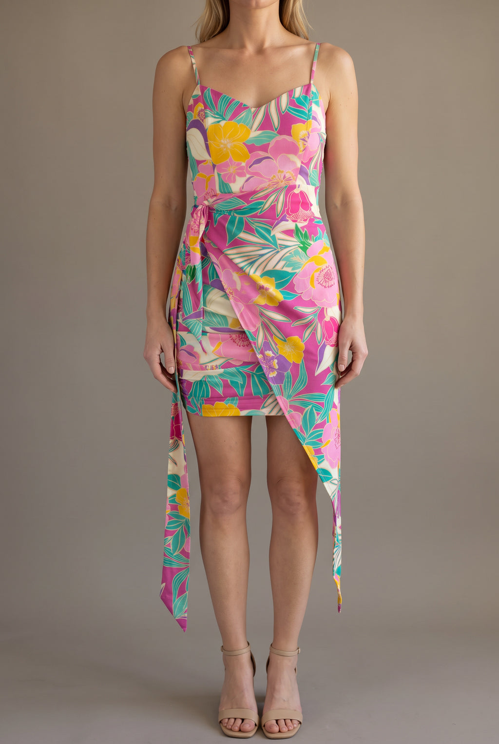 Front view of the Dressed for Sweet Moments Mini Dress showing its wrap fit and naturally hanging tails.