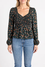 Front fit of the Don't Give Up floral top showing its sweetheart neckline, sleeves and peplum hem.