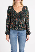 Front fit of the Don't Give Up floral top showing its sweetheart neckline, sleeves and peplum hem.