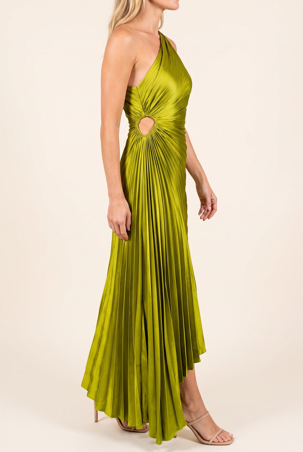 Angled side fit of the Crazy for You Pleated Maxi Dress showing its waist cutout and high-low drape.