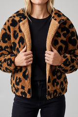 Going Wild leopard jacket held open to show its interior finish and lower-front pocket areas.