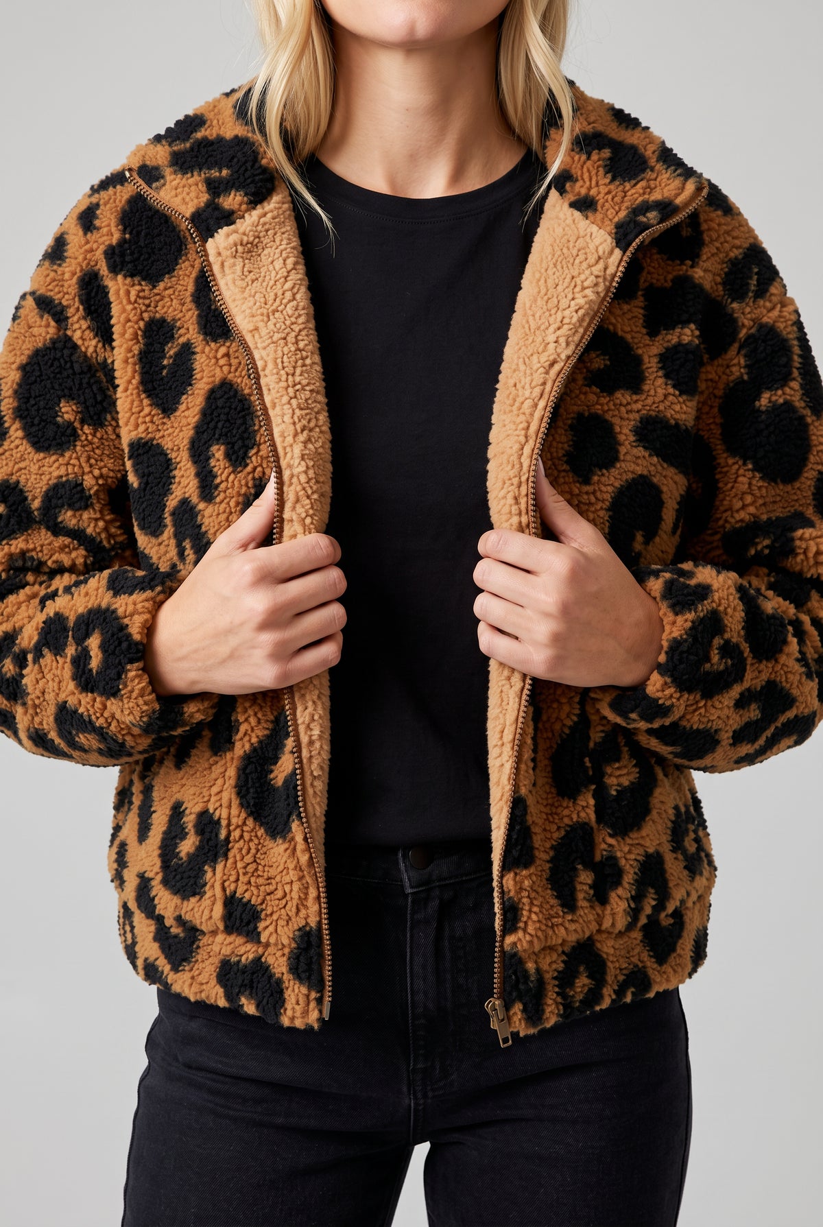 Going Wild leopard jacket held open to show its interior finish and lower-front pocket areas.