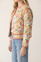 Side fit of the Small/Orange Good Feeling Cotton Jacket showing its boxy crop and sleeve shape.